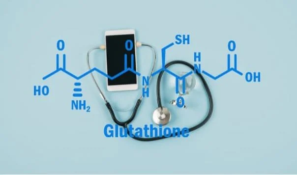 Composite image of a chemical diagram of glutathione superimposed on an image of a stethoscope and a mobile phone