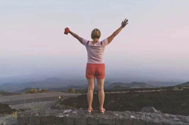 A mature woman finding peace and vitality in the great outdoors. Discover the joy of connecting with nature at any stage of life
