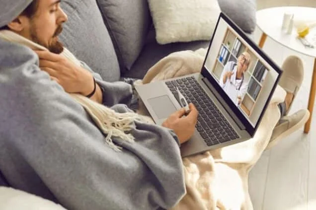 Sick person using telehealth for urgent care