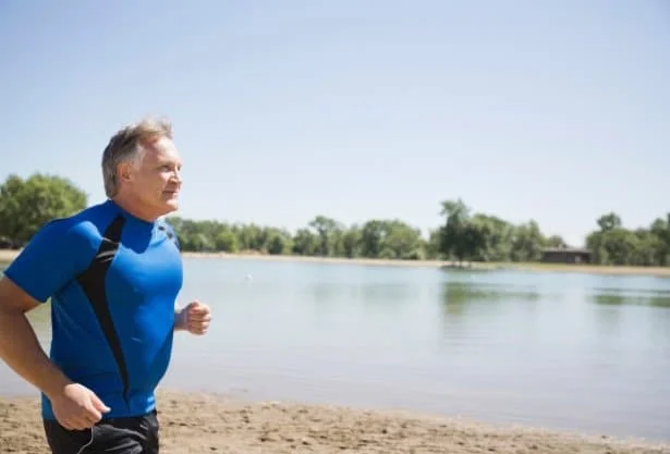 Photo of middle-aged man jogging for the blog post on The 6 Silent Killers Men Ignore.