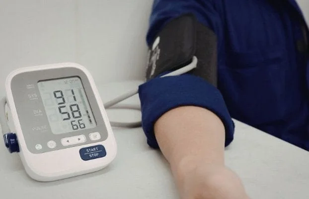 Photo of man having his blood pressure taken for the blog post on The 6 Silent Killers Men Ignore.