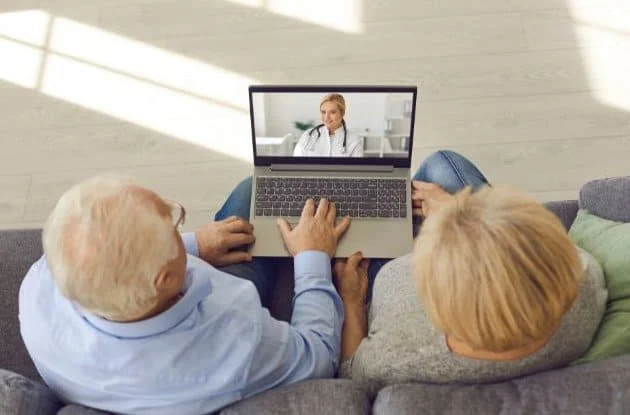 Older couple seeing a healthcare provider via telehealth