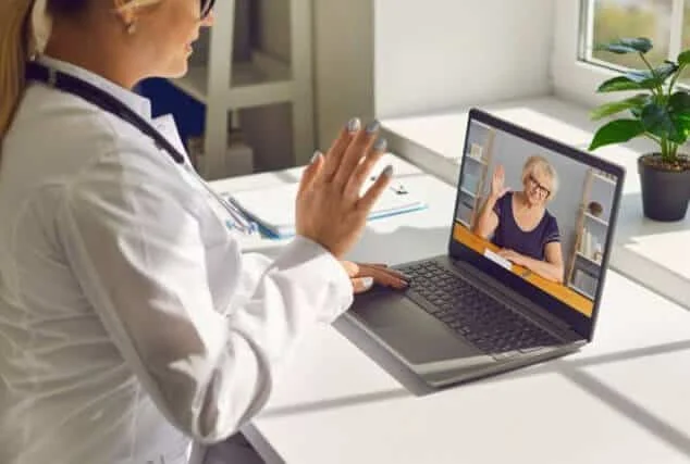 medical professional saying hello to patient during online appointment for hamiltontelehealth blog post on MIC injections
