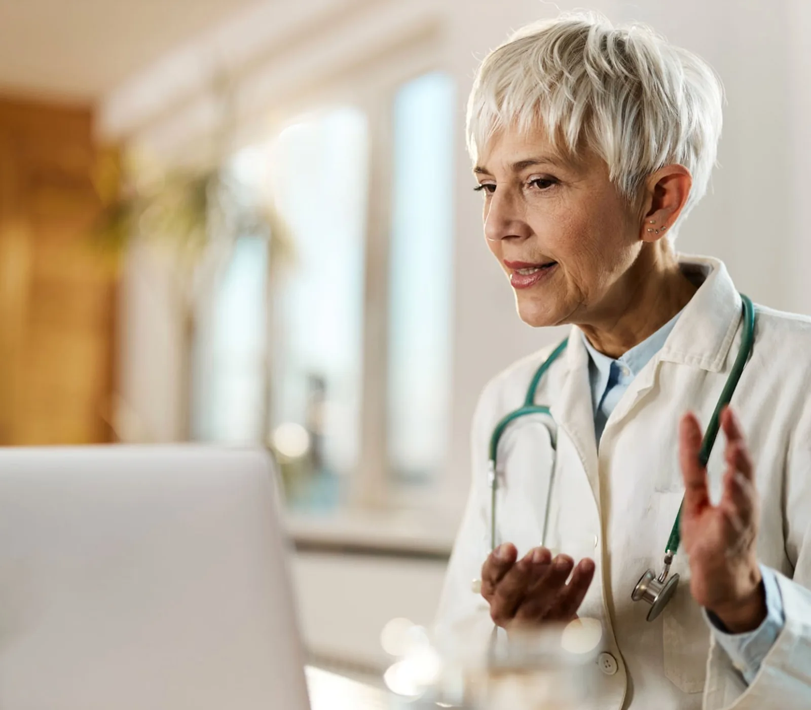 Telehealth clinician discussing care workflow on a video call