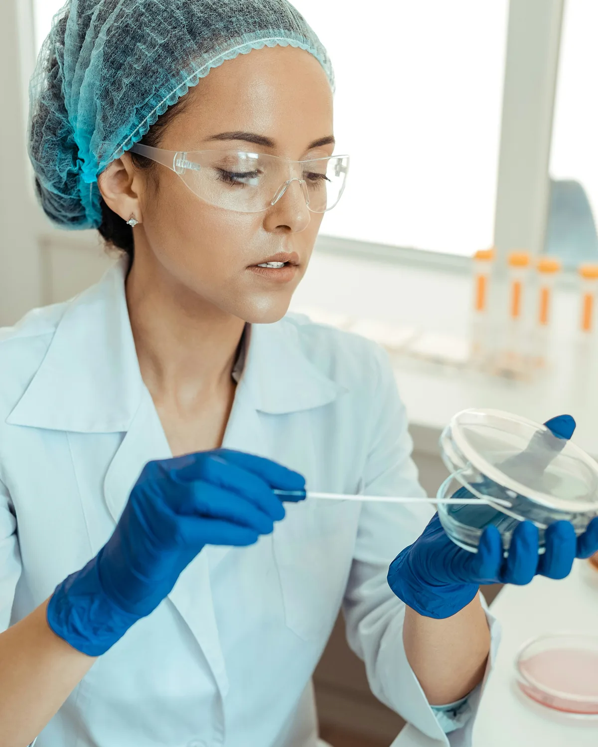 Lab professional preparing a sample for testing