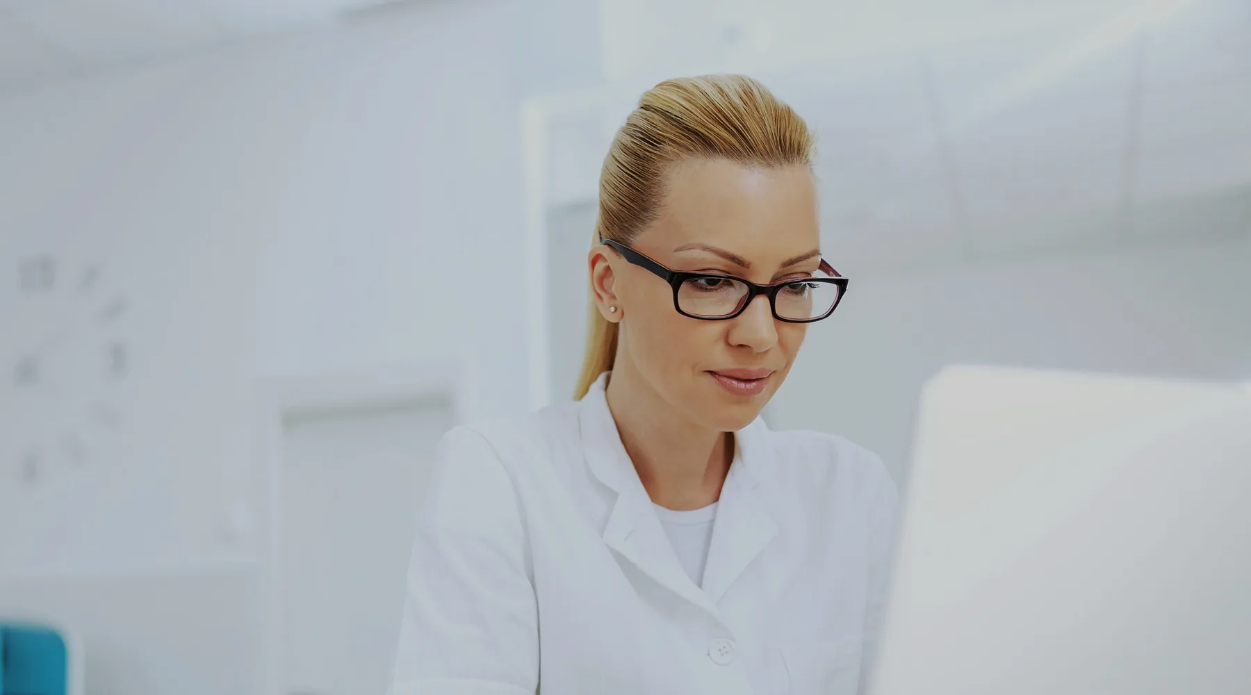 Provider reviewing lab work and care planning notes