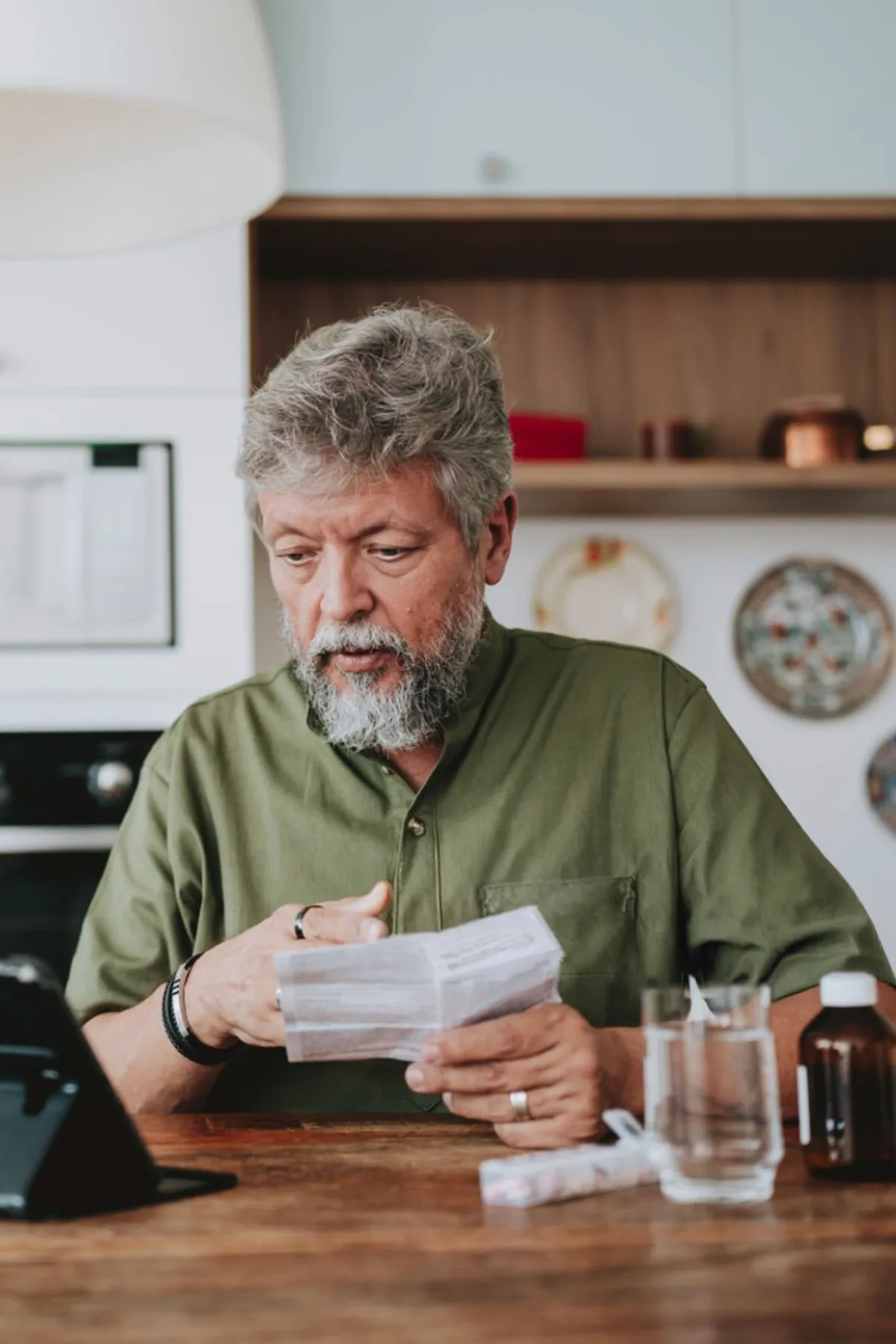 Patient reviewing medication refill information through Hamilton Telehealth