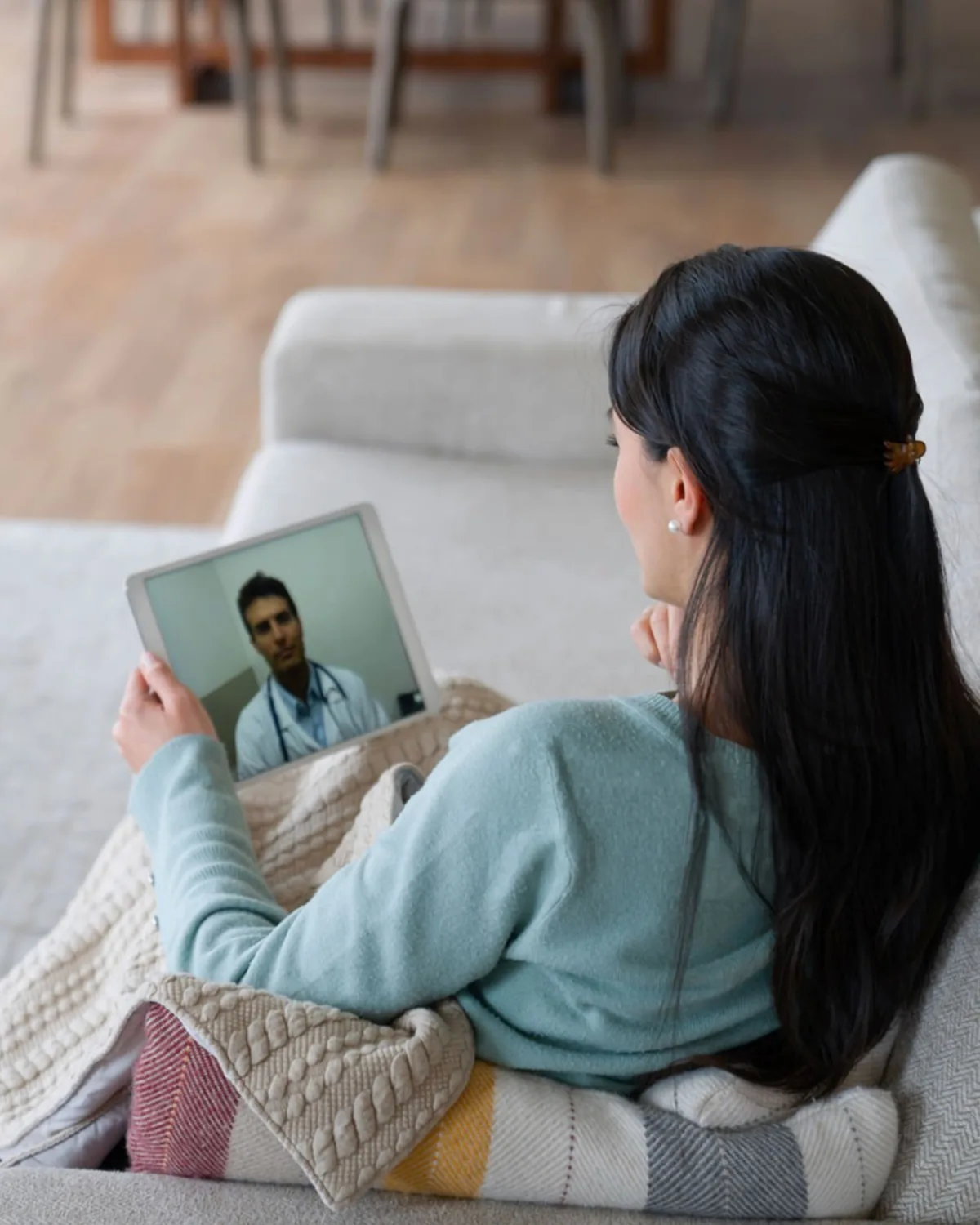 Patient discussing specialty pharmacy questions with a telehealth provider