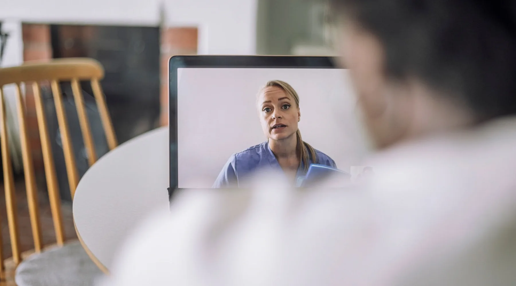 Patient speaking with a telehealth provider about urgent care next steps