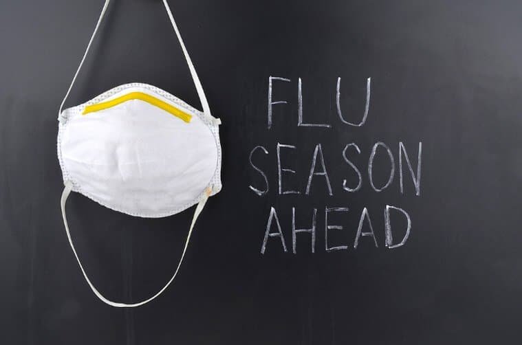 Picture of a mask and the words "flu season ahead" beside it.