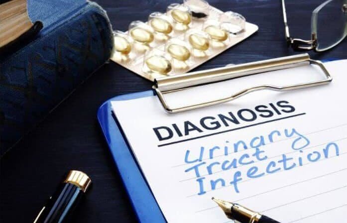 Image of clipboard with the words "Diagnosis Urinary Tract Infection"