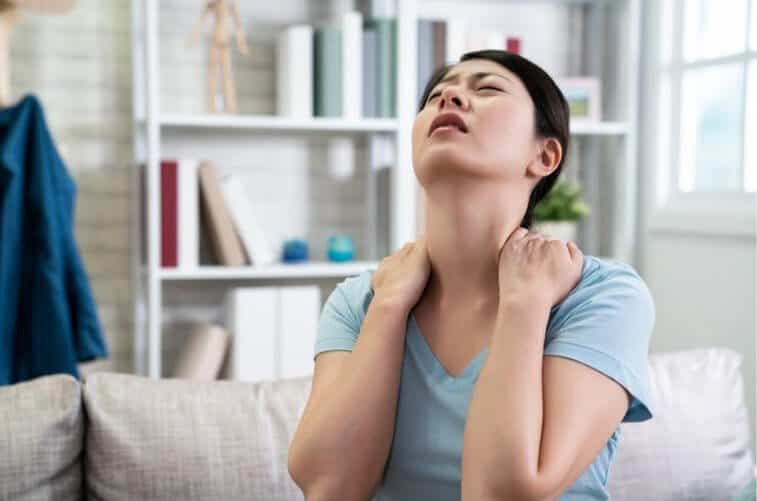 Image of a woman experiencing body aches