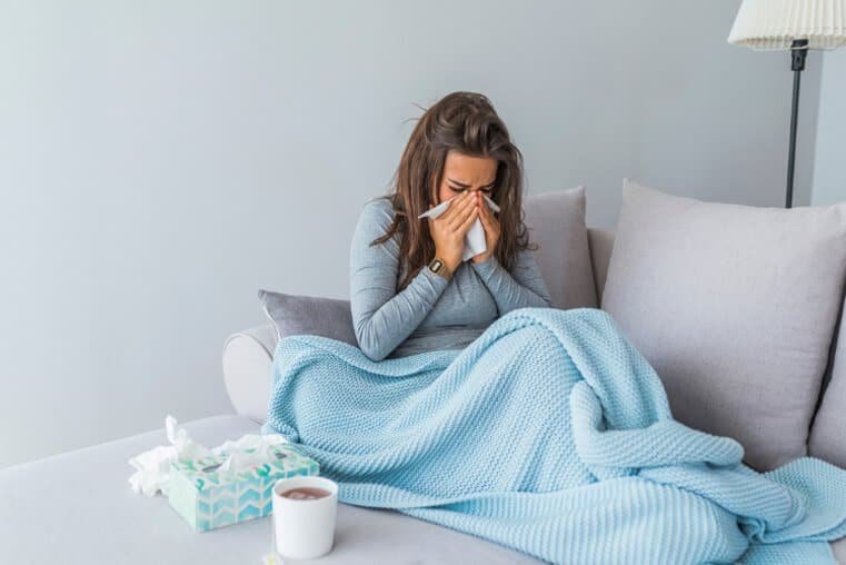 Image of a woman sick with the flu