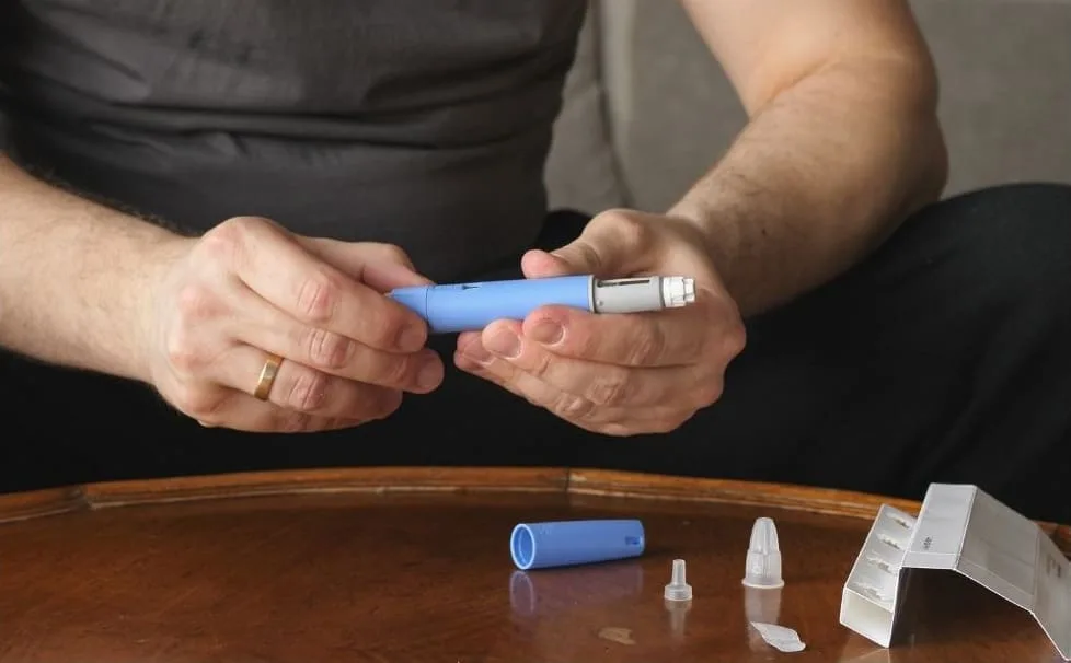 Photo_of_man_preparing_weight_management_injection_for_the_article_Your_Ultimate_Guide_to_Weight_Loss_and_Weight_Management