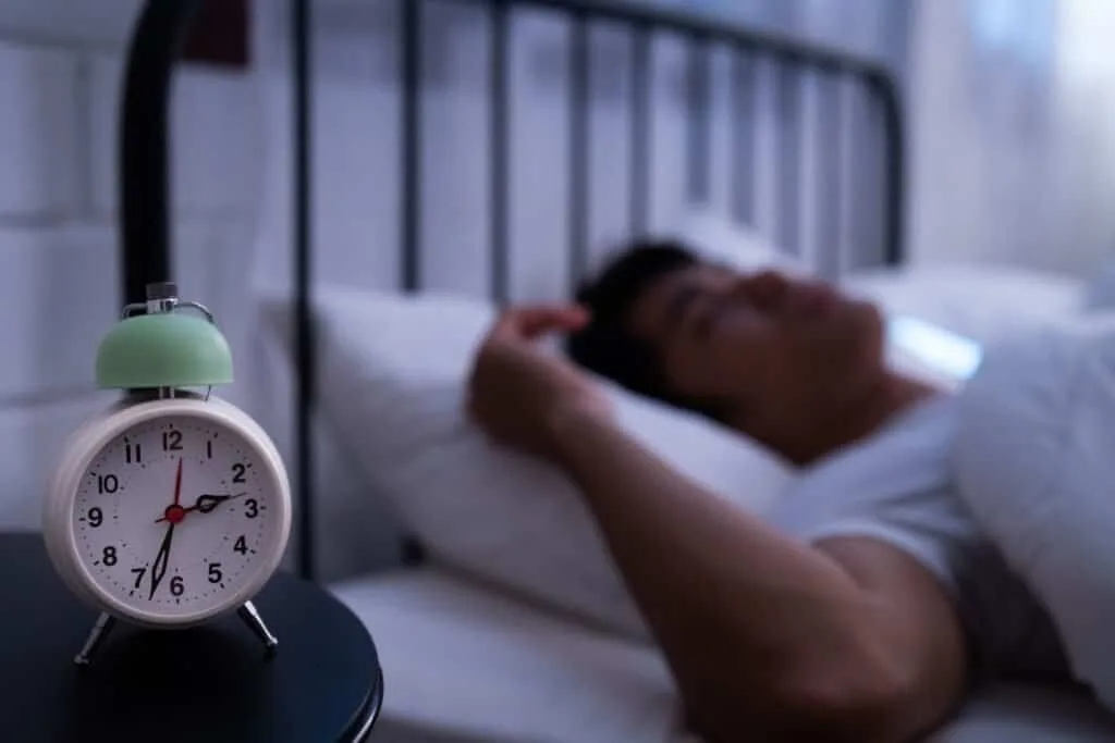 Image of a man getting a good night's sleep.