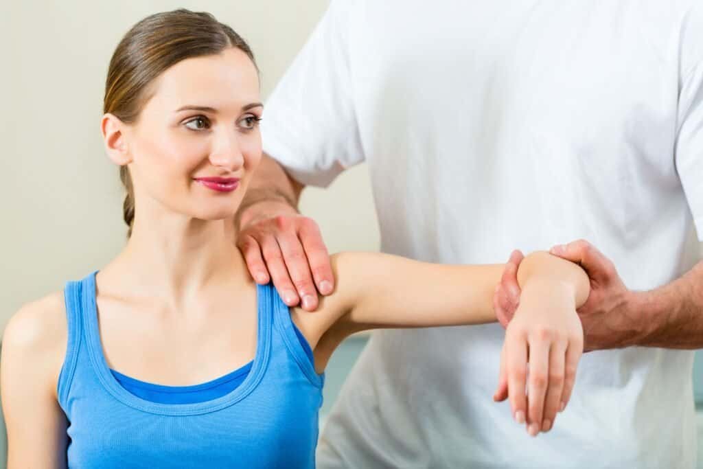 Woman getting examined by a physical therapist