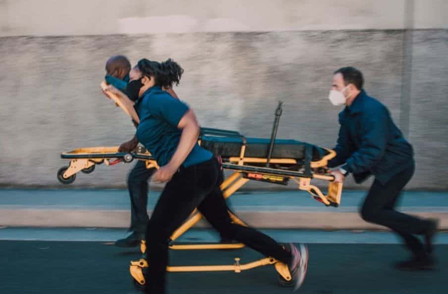 Paramedics pushing a stretcher for the article Navigating Emergency and Urgent Care in the Telehealth Era