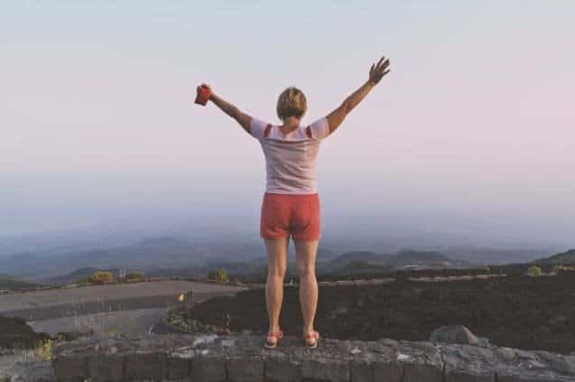 A mature woman finding peace and vitality in the great outdoors. Discover the joy of connecting with nature at any stage of life