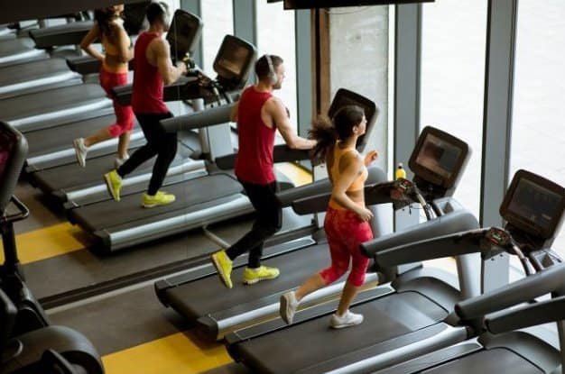 Photo of people working out on treadmills