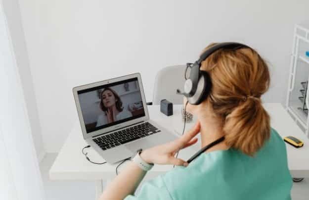 A healthcare provider communicating with a patient via internet
