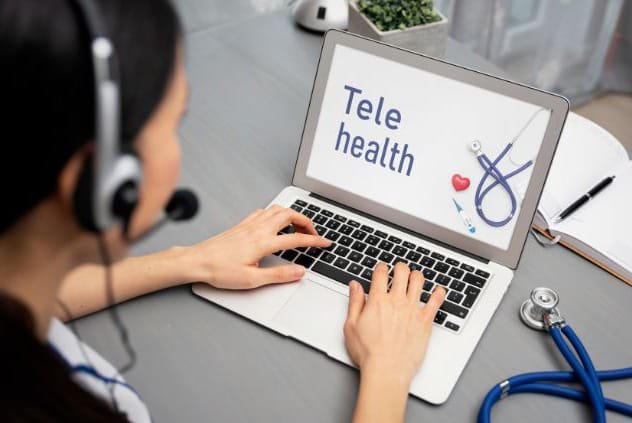 Photo of a healthcare provider doing a telehealth consult on her laptop