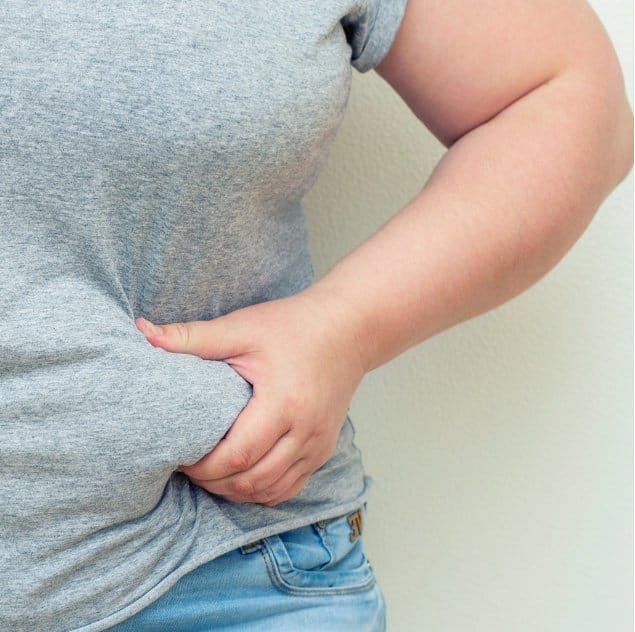 Woman Pinching Stomach Fat